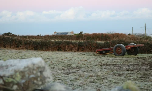 Frost in a field and on farm equipment in the Penwith landscape