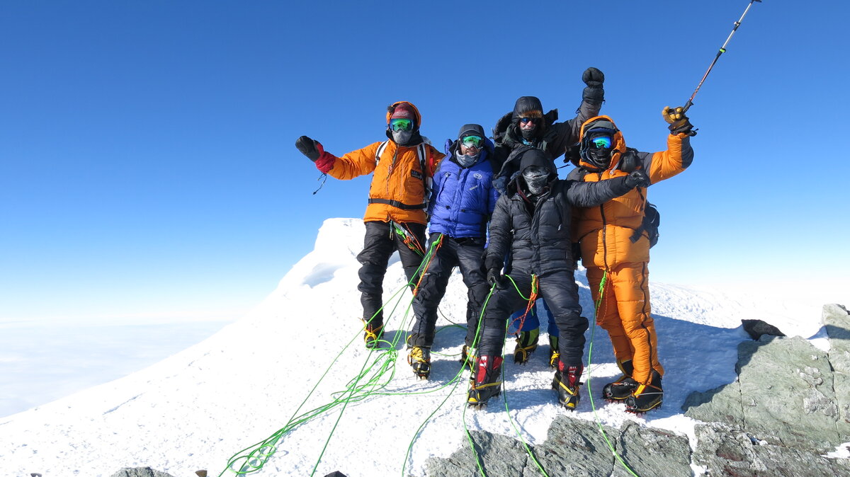 Climbing team celebrates on the summit