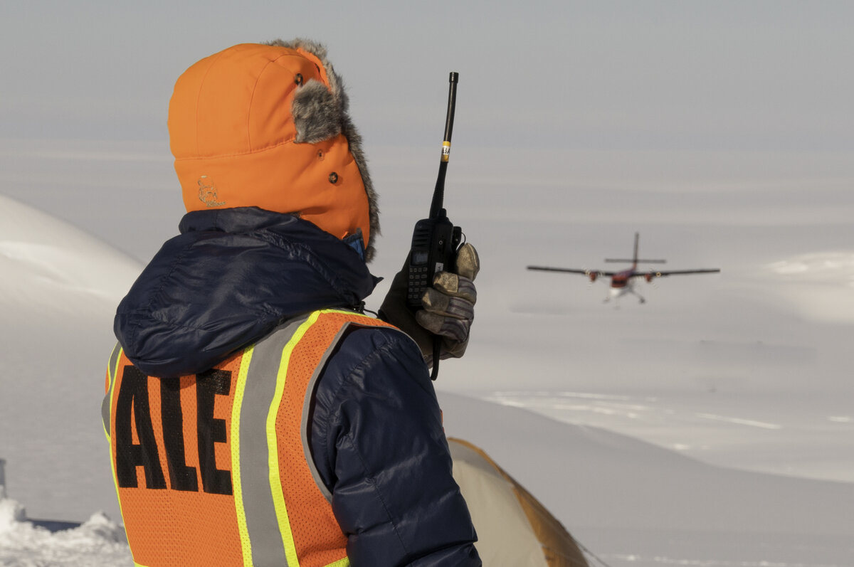ALE guide talks to incoming Twin Otter by VHF radio