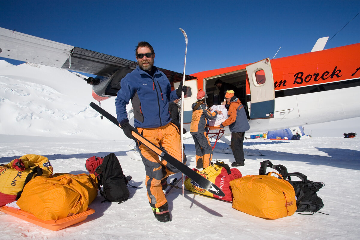 Climbers unload gear from Twin Otter upon arrival